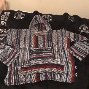 Oversized knit “drug rug” sweater